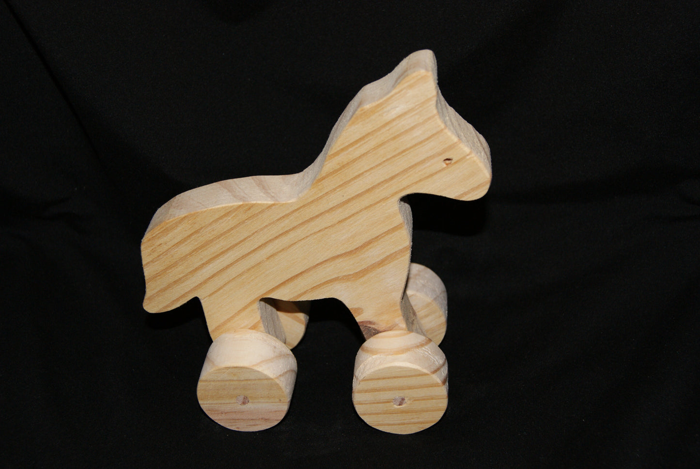 Handcrafted wooden animal Horse toy on wheels