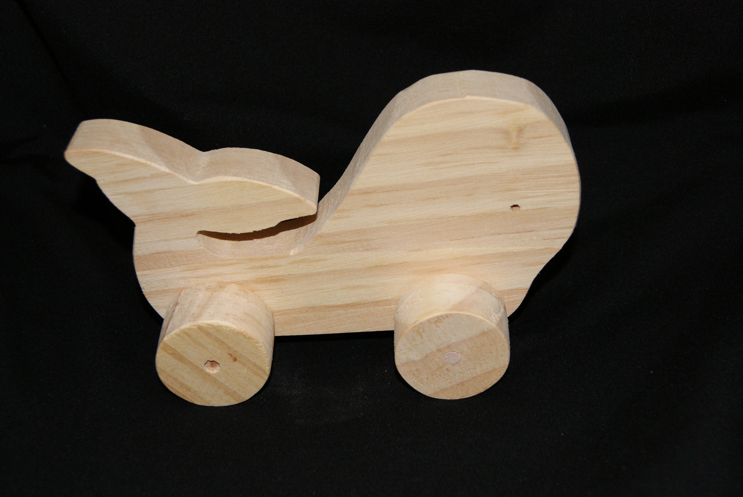 Handcrafted wooden animal whale toy on wheels
